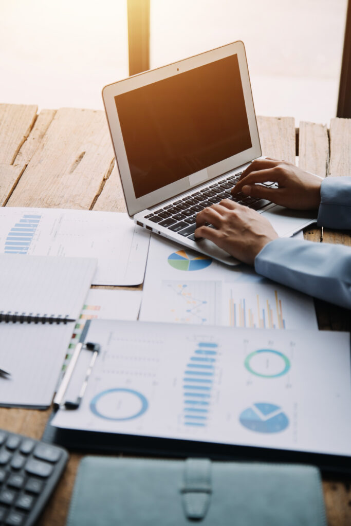 Financial analysts analyze business financial reports on a digit